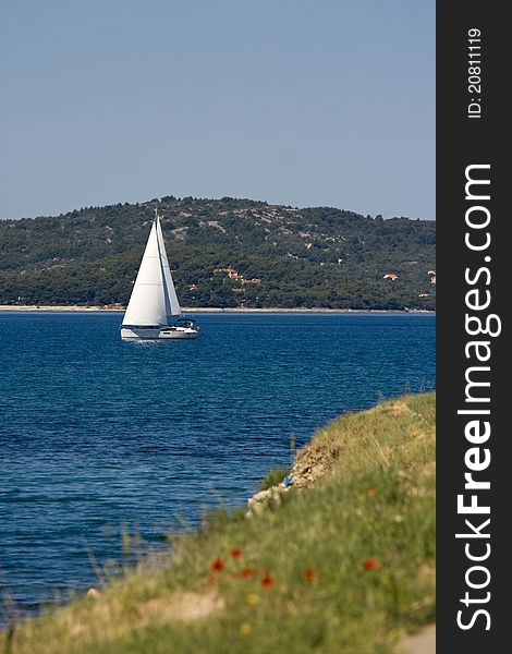 White sailing boat on the Sukosan coastline