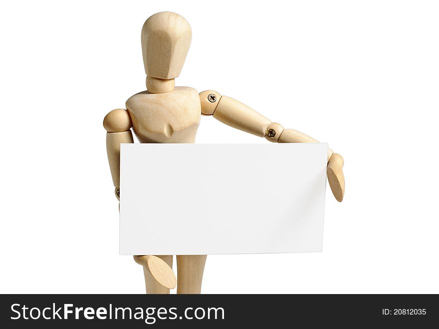 Wooden mannequin holds in hand a blank paper sheet isolated on white background. Wooden mannequin holds in hand a blank paper sheet isolated on white background