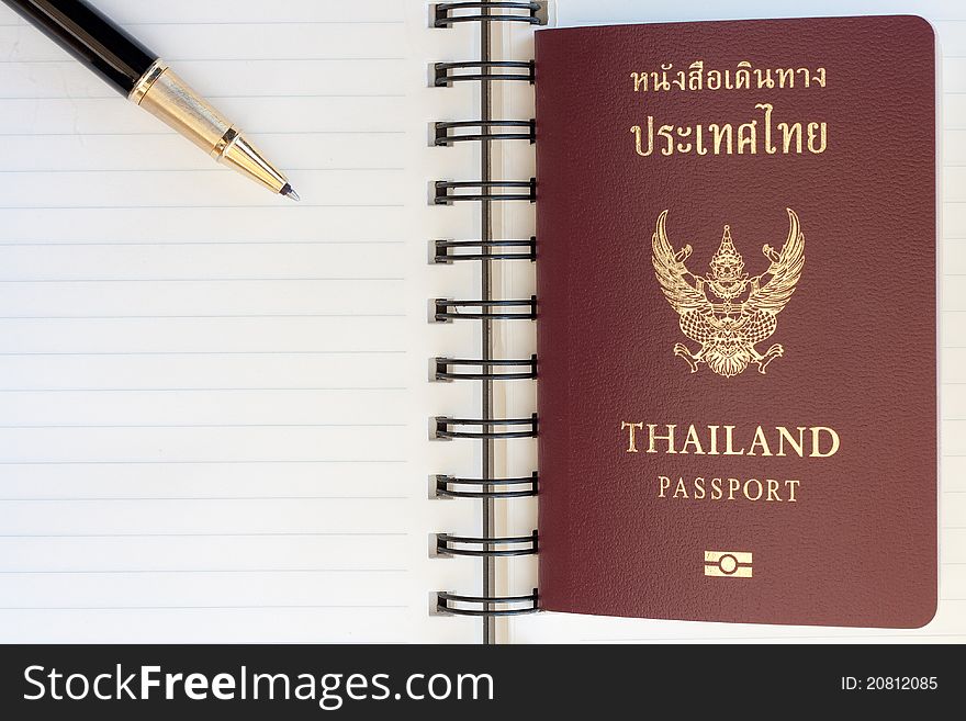 Thailand passport and pen