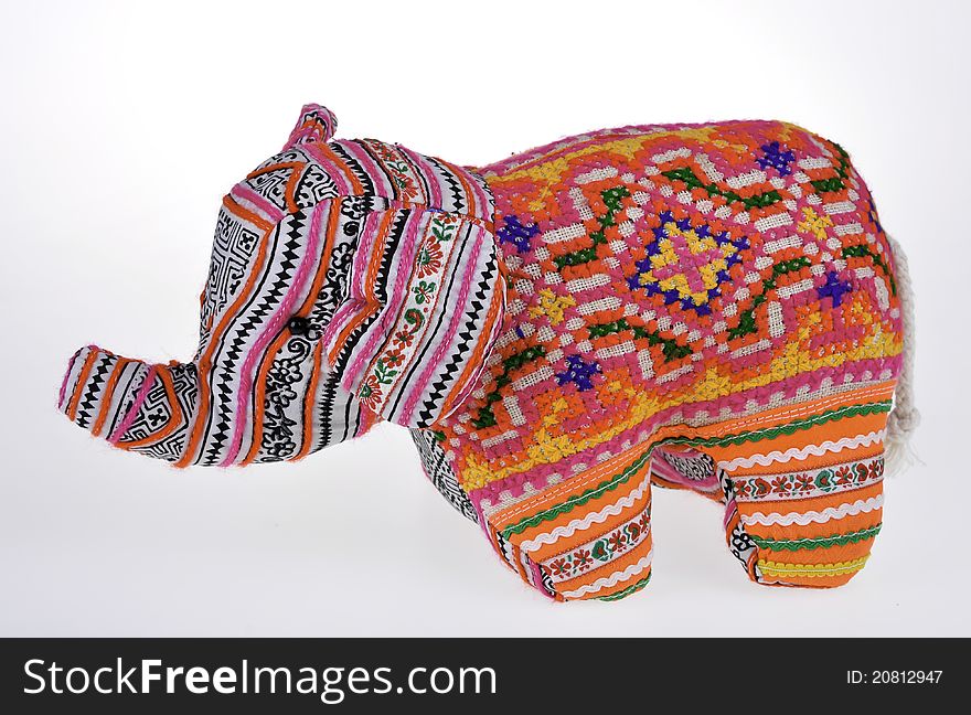 A colorful stuffed elephant isolated on white background