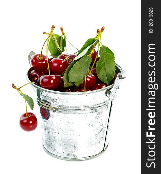 Pot full with fresh sour cherries over white background. Pot full with fresh sour cherries over white background