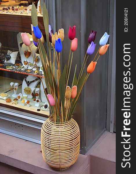 Artificial Tulips in a cane vase next to a jewelery shop in Heidelberg, Germany, Europe