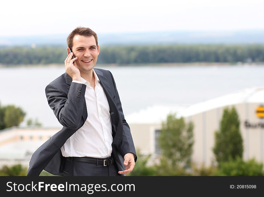 Young man with mobile phone outdoors. Young man with mobile phone outdoors