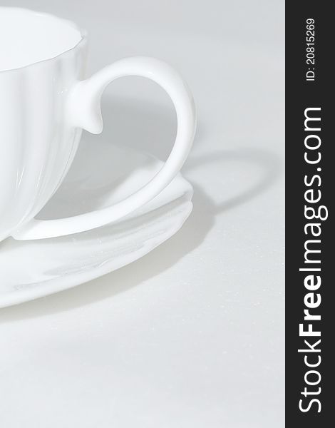 Still life - White cup and saucer on white background. Still life - White cup and saucer on white background