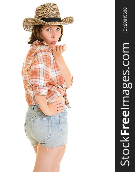 Woman cowboy sends a kiss on a white background.