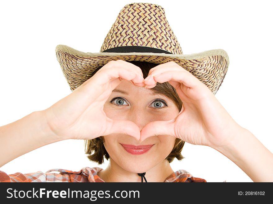 Cowboy woman doing a heart with her hands on a white background. Cowboy woman doing a heart with her hands on a white background.