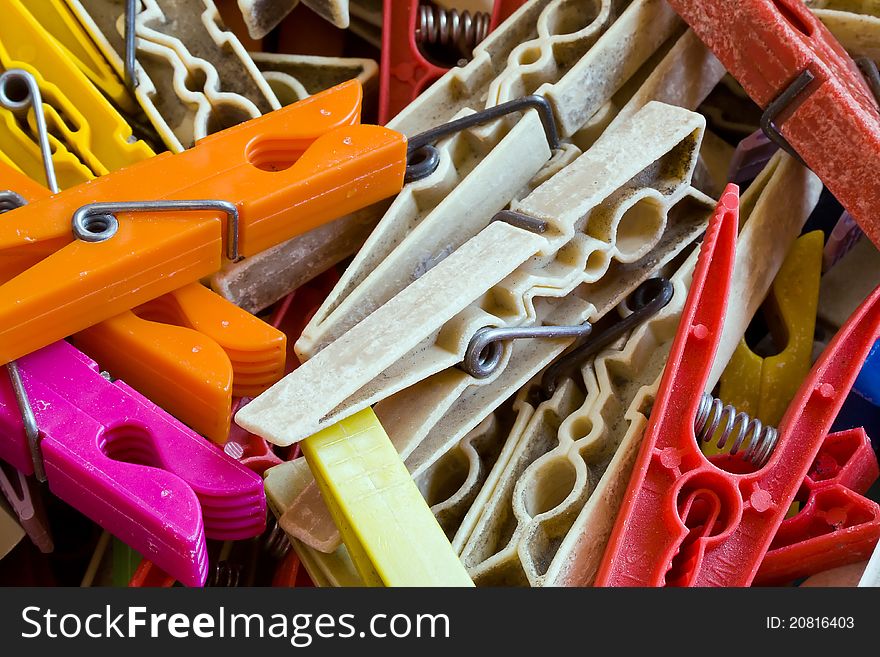 Closeup of group plastic and wood pegs