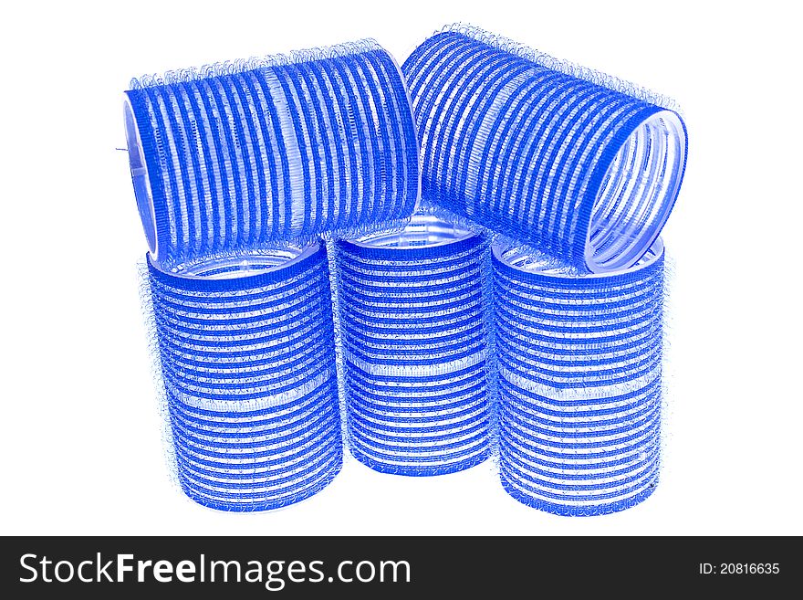 A few blue hair curlers on a white background