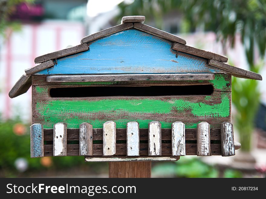 The close up old wood postbox.