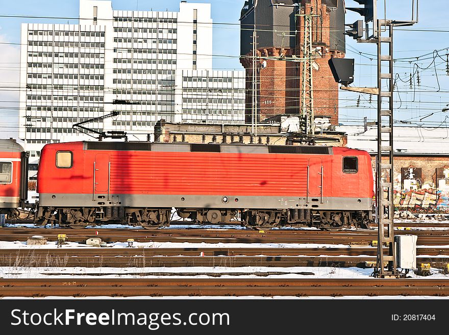 Red railway in motion in the station