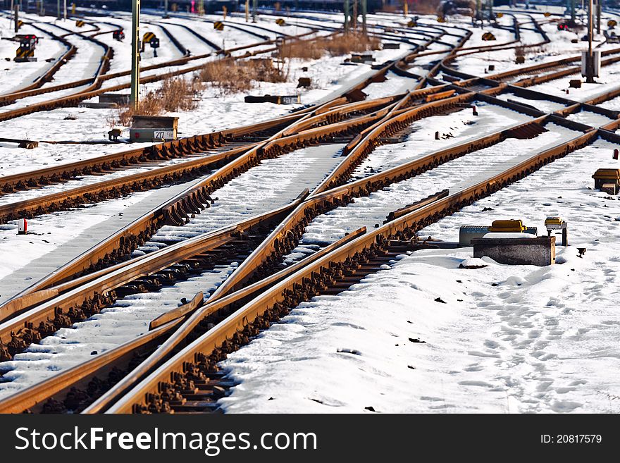 Rails in winter at the station covered with snow