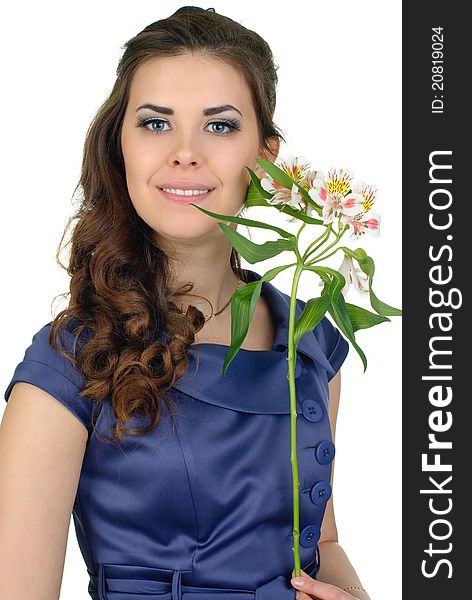 Young cute woman in blue dress with flower posing in studio. Young cute woman in blue dress with flower posing in studio