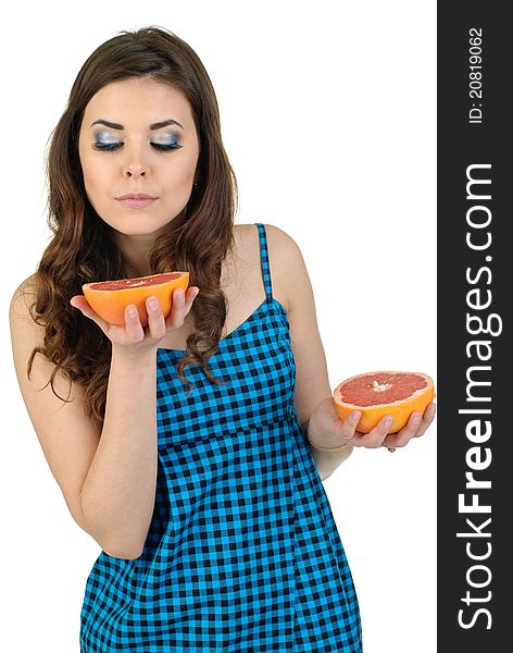 Young cute woman in blue dress with fresh fruit. Young cute woman in blue dress with fresh fruit