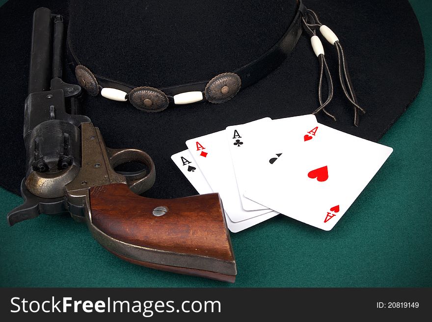 Four aces on table and old colt