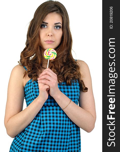 Young cute woman in blue dress with candy. Young cute woman in blue dress with candy