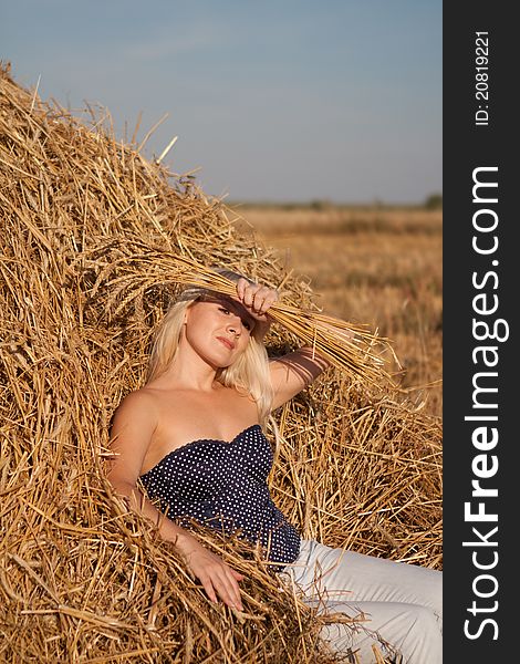 The Beautiful Girl In The Field With Wheat On The