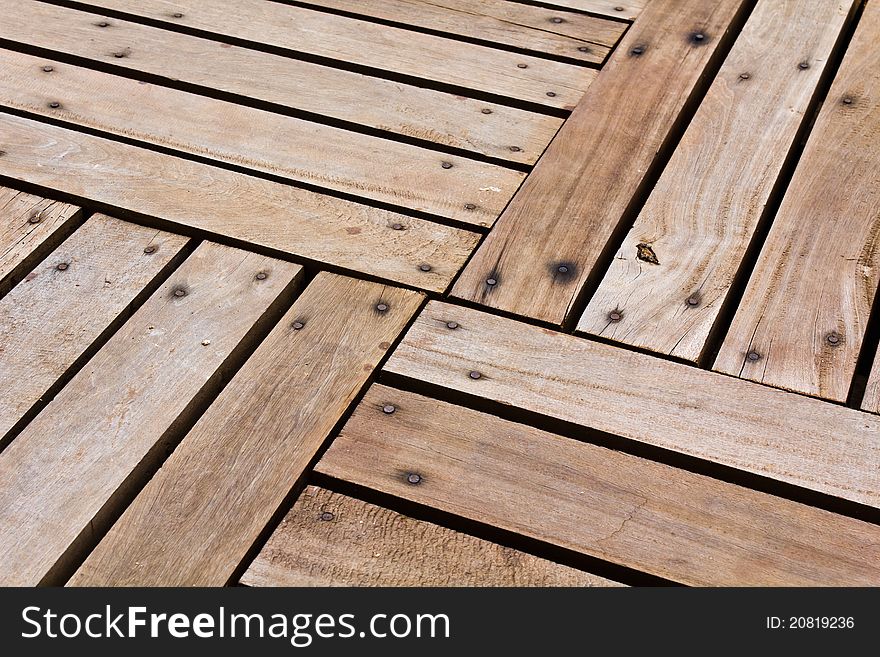 Patterns and textures of a wooden planks pavement