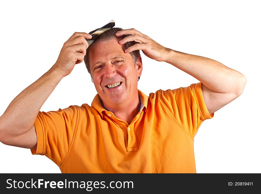 Man combing his hair in the studio