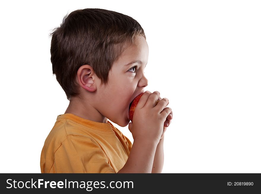 Child eating an apple on white background