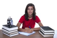 Teenage Girl Studying On Her Desk Royalty Free Stock Photos