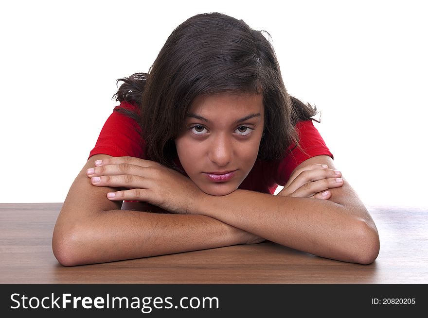 Melancholy brunette teenage girl on white background