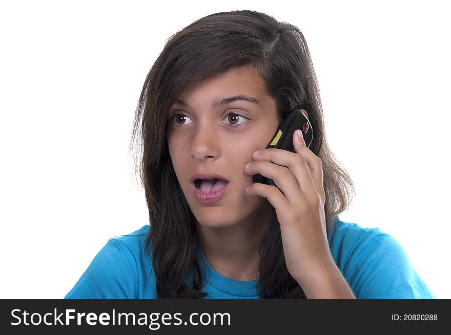 Teenage girl talking on the phone on white background