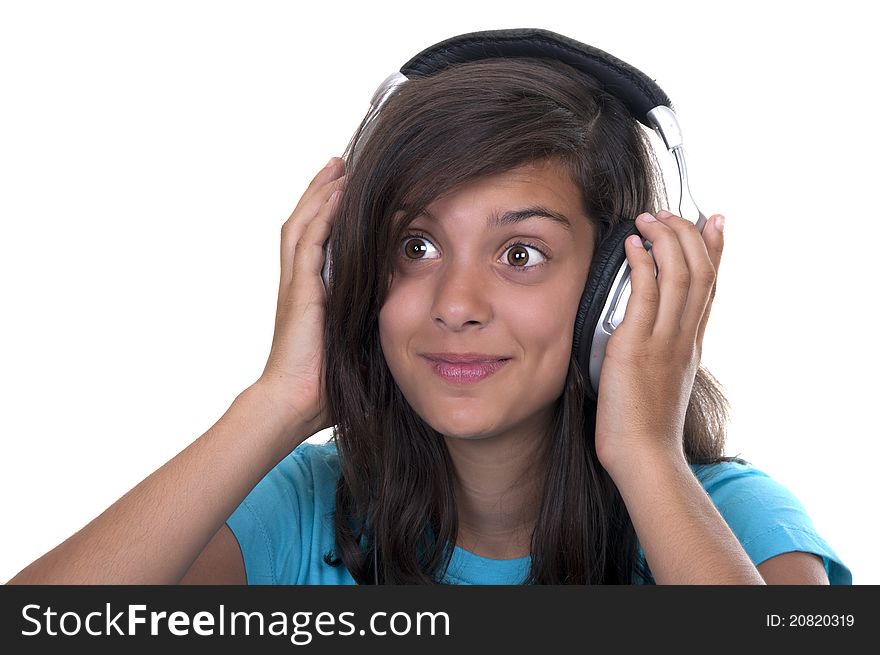 Teenage girl listening music with headphones on white background