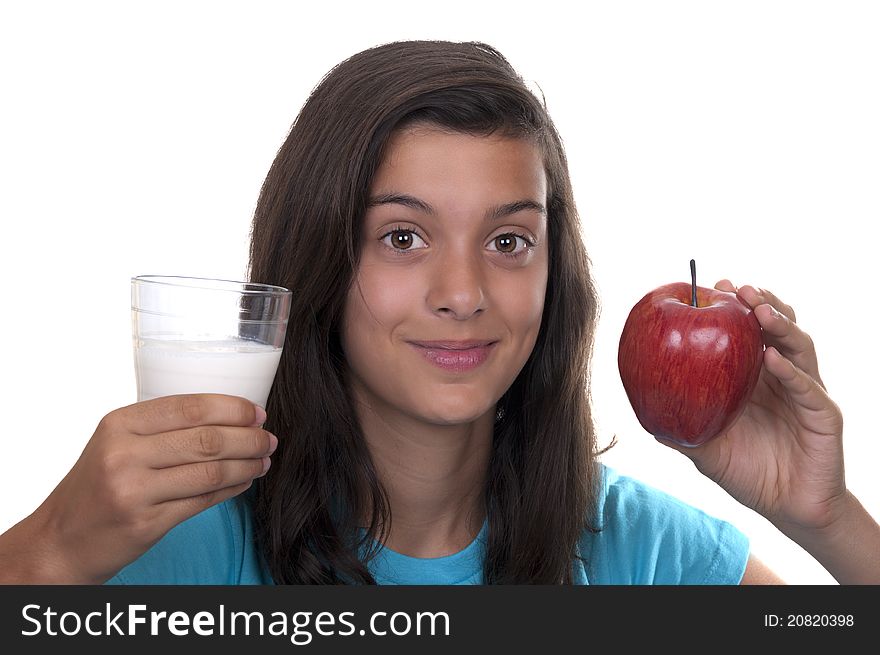 Teenage girl with red apple and a glass of milk on white background