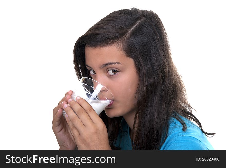 Teenage girl with glass of milk on white background