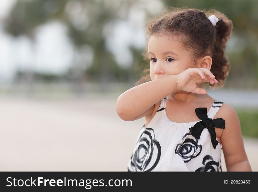 Image of a child wiping her mouth