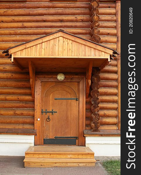 Wooden house built in the traditional russian style of the eighteenth sentury. The entrance. Wooden house built in the traditional russian style of the eighteenth sentury. The entrance