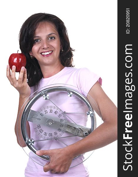 Woman with weigh and apple on white background