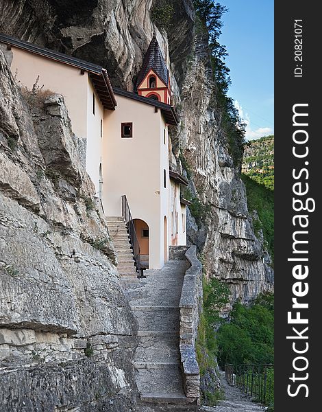 San Colombano hermitage in the North of Italy, Trentino A.A. region. Itâ€™s built over a overhanging rock of 120 meters. IX century