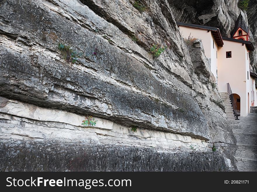 San Colombano hermitage in the North of Italy, Trentino A.A. region. Itâ€™s built over a overhanging rock of 120 meters. IX century