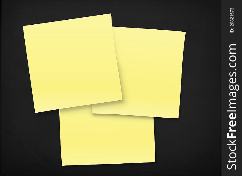 3 yellow notes on a black textured board. 3 yellow notes on a black textured board.