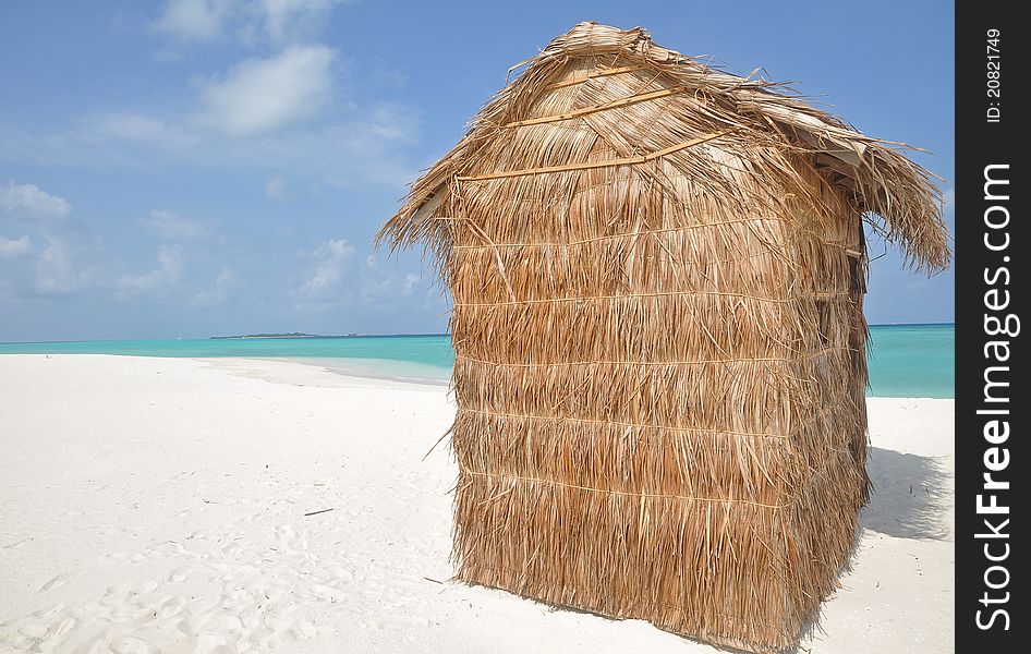 Grass hut on a tropical island in the indian ocean. Grass hut on a tropical island in the indian ocean