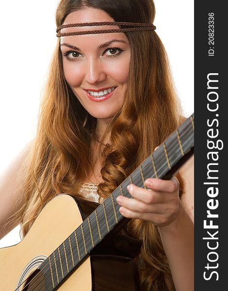 Hippie woman with long hair playing the guitar at an isolated white background. Hippie woman with long hair playing the guitar at an isolated white background