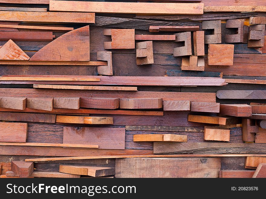 Wall made of different sizes of cut wood. Wall made of different sizes of cut wood.