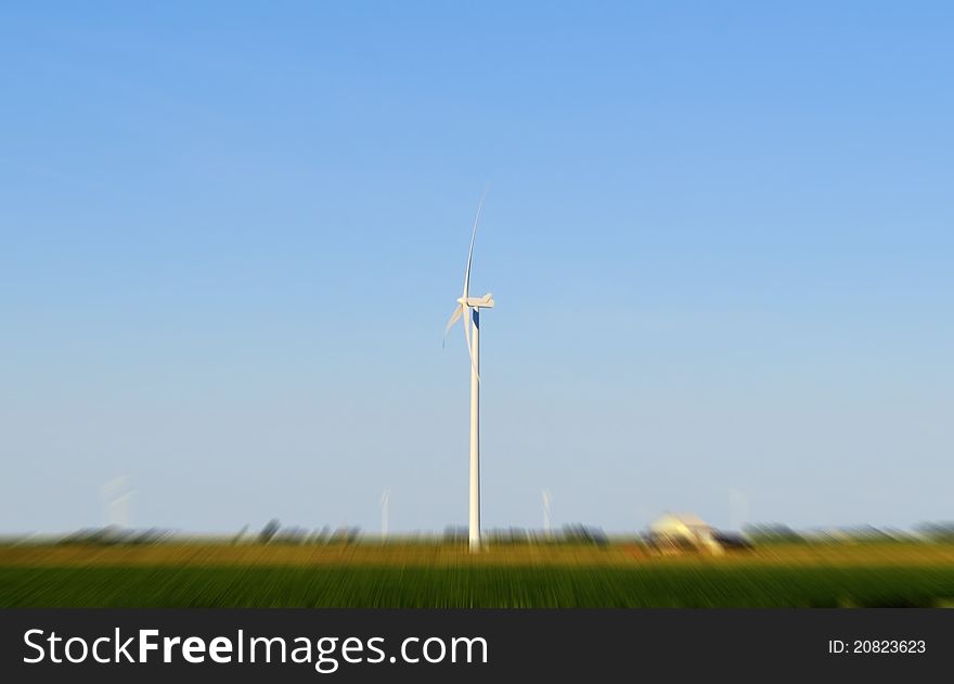 Wind mill in a blured field