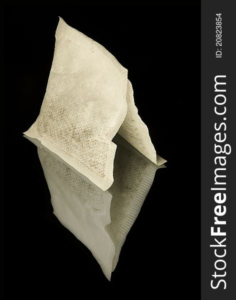 Two Tea Bags On The Black Background