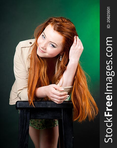 Studio shot of beautiful red haired woman