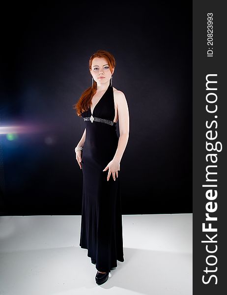 Studio shot of beautiful red haired woman
