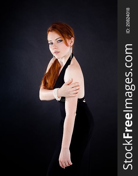 Studio shot of beautiful red haired woman