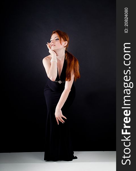 Studio shot of beautiful red haired woman