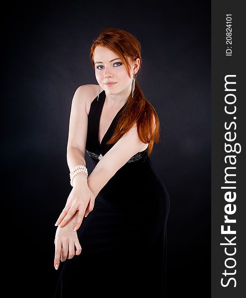 Studio shot of beautiful red haired woman