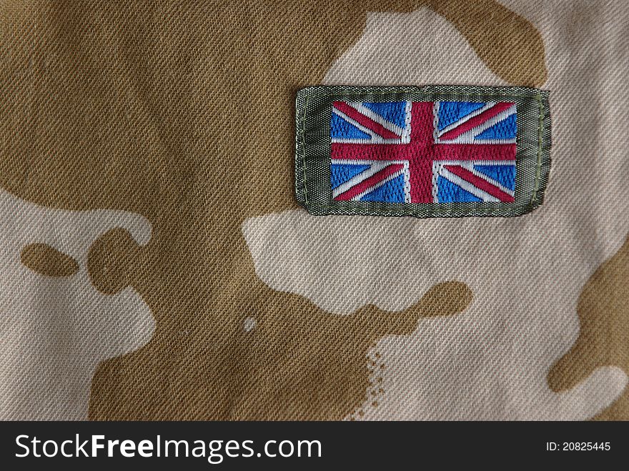 Closeup of british combat uniform with a flag