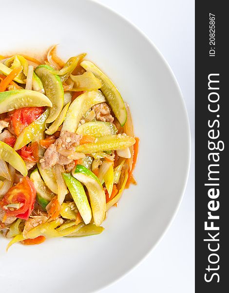 Stir-fried sweet and sour pork with cucumber and tomato and green peppers