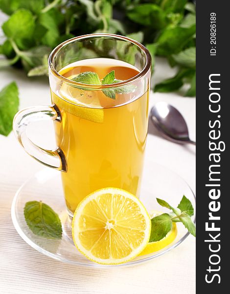 Cup of hot  tea with mint and lemon. Cup of hot  tea with mint and lemon