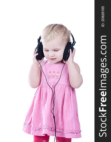 Baby with headphones, isolated on a white background