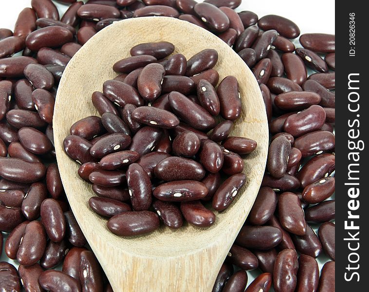 Dried red beans on a wooden spoon. Dried red beans on a wooden spoon.